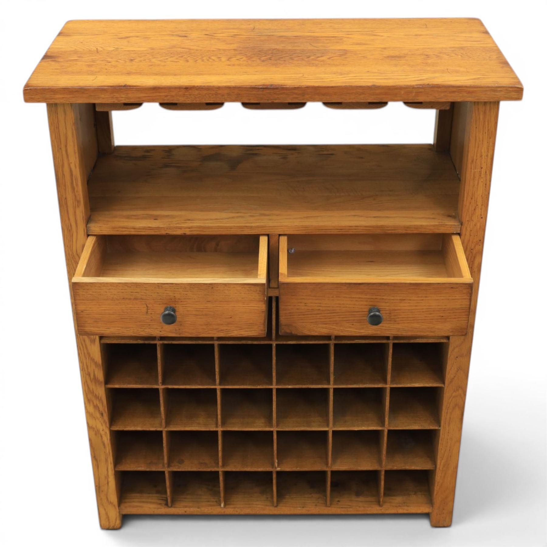 Traditional design light oak wine server, rectangular overhanging top above an open undertier with grooves for wine glasses, fitted with two drawers, lower section with open bottle racks for thirty five bottles, raised on square supports