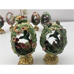 Six Franklin Mint House of Faberge garden eggs, to include Garden of Joy, Beauty in the Garden, Jewels in the Garden, Garden Majesty, Splendour in the Garden and Rainbow in the Garden, together with a Franklin Mint Carousel Rose Clock, all with certificates of authenticity, clock H16.5cm