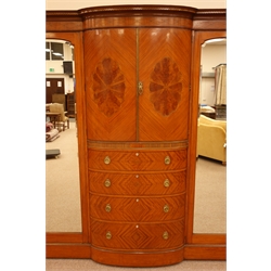  Edwardian Sheraton Revival satinwood bow breakfront wardrobe, Greek Key cornice above a pair of oval fan veneer panel doors and four quarter veneered graduated drawers, enclosed by two mirror doors, on a plinth base, H221cm, W200cm, D73cm  