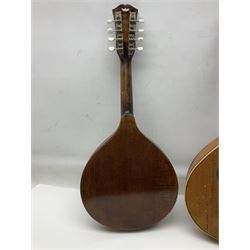 Italian eight-string mandolin with maple back and ribs and spruce top with inlaid floral marquetry panel within a fragmented mother-of-pearl border L61cm; cased; and a (damaged) German 'Michigan' mandolin for spares or repair (2)