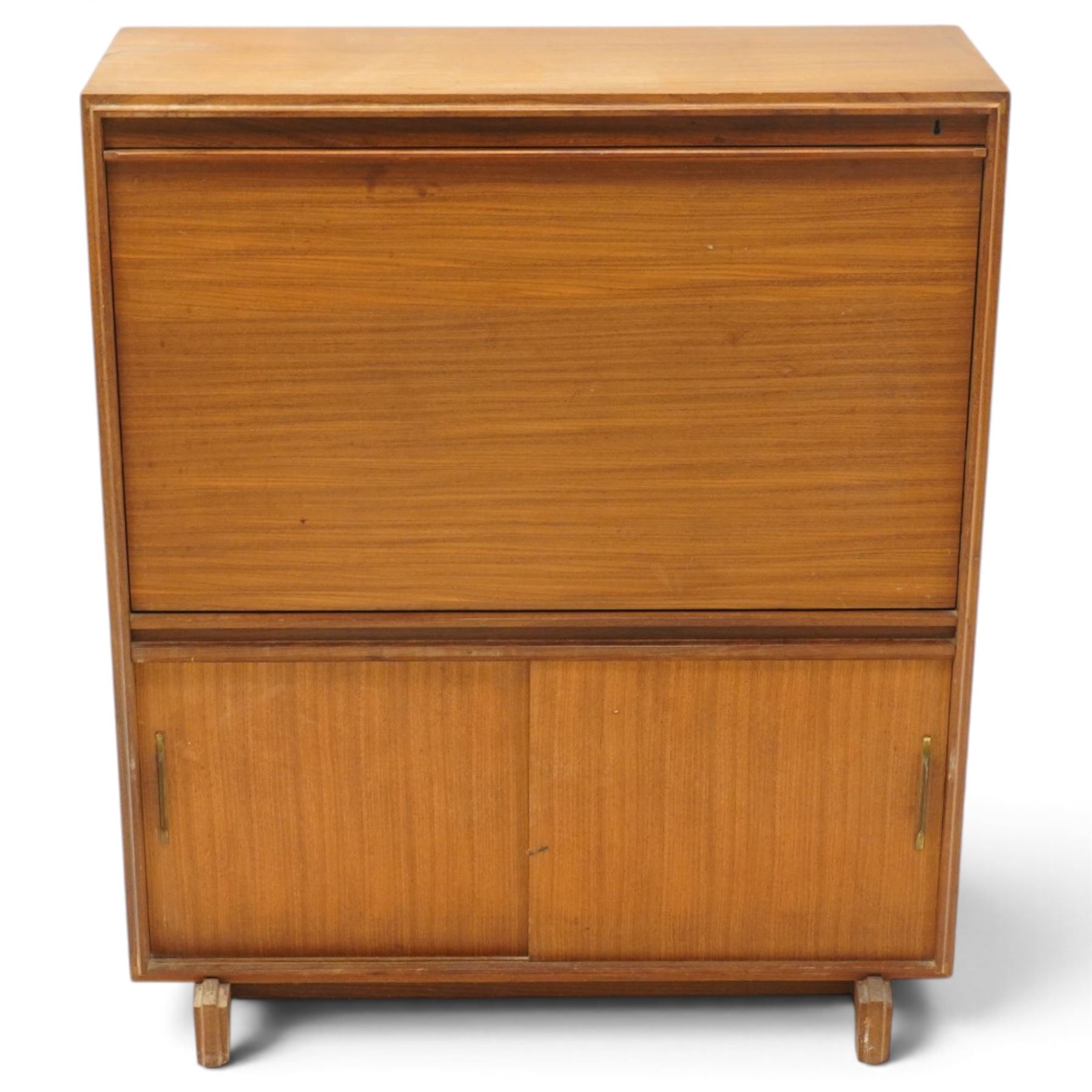 Robert Heritage (1927-2008) for Beaver & Tapley - Mid 20th century teak bureau, fall front with fitted interior, above a sliding door cabinet, raised on short supports