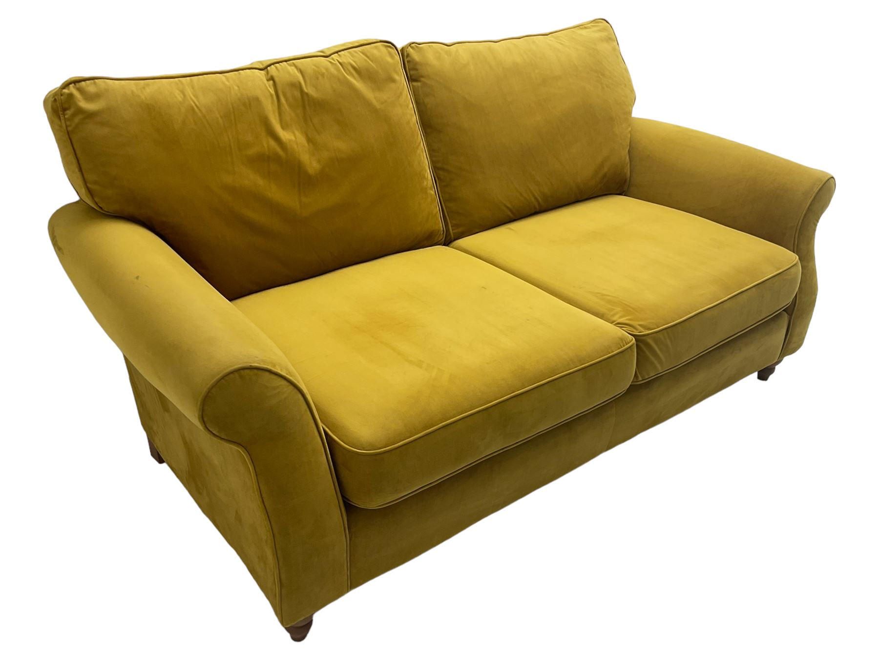 Next Furniture - traditional shaped three-seat sofa, upholstered in mustard velvet, rolled arms with pipping, on turned front feet