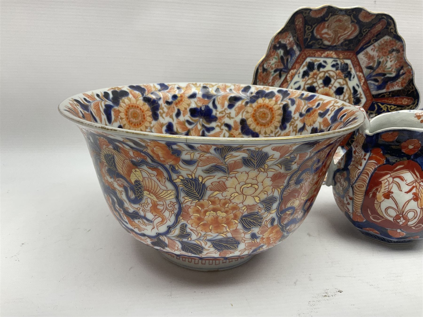 Two Japanese Imari bowls, together with Imari dish with scalloped edge and jug, largest bowl, H12cm