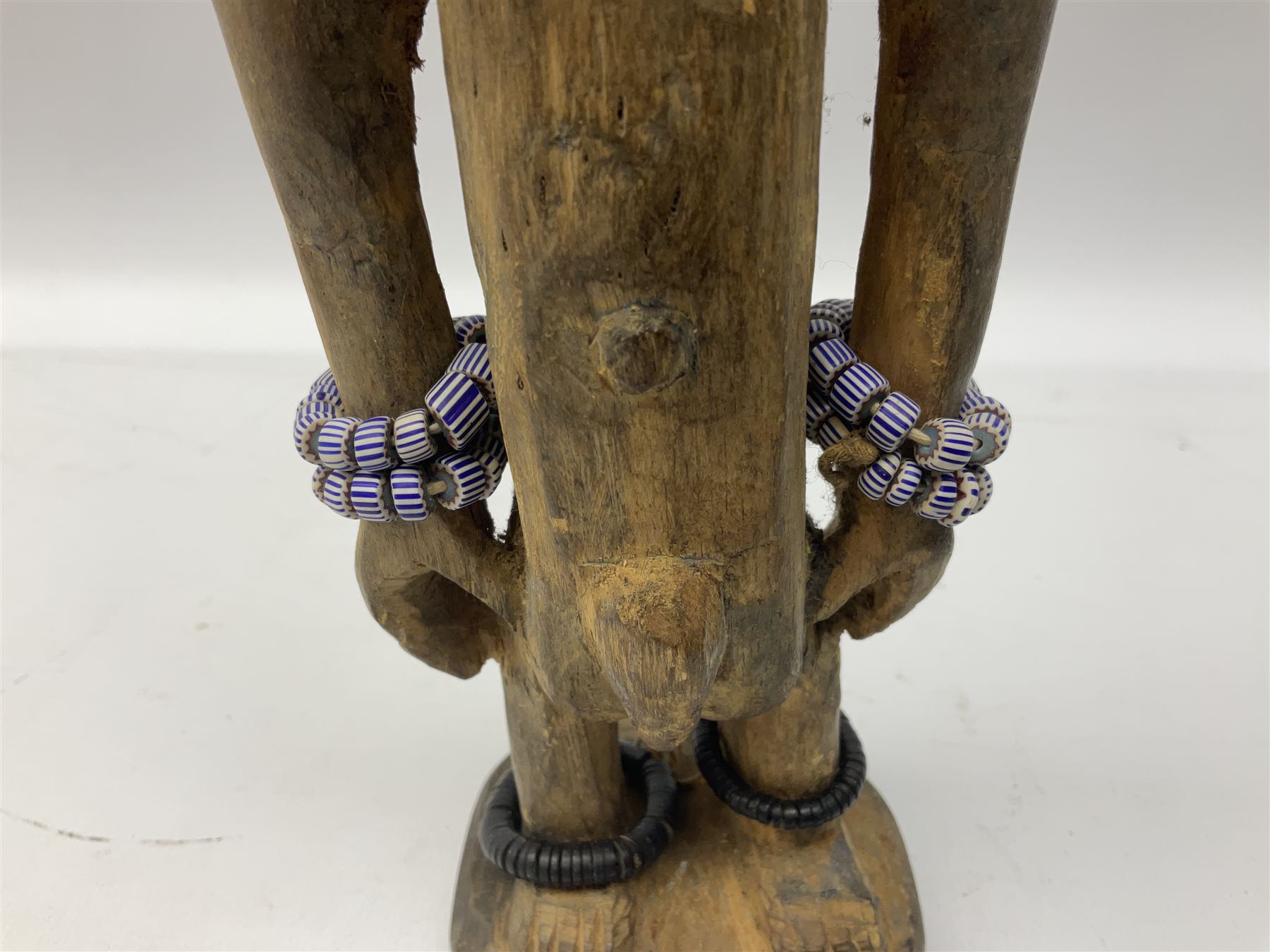 Early 20th century West African Yoruba family wooden figure of Orisha Oko, the god of farming/agriculture, carved from the solid, bears manuscript label of provenance verso H26.5cm