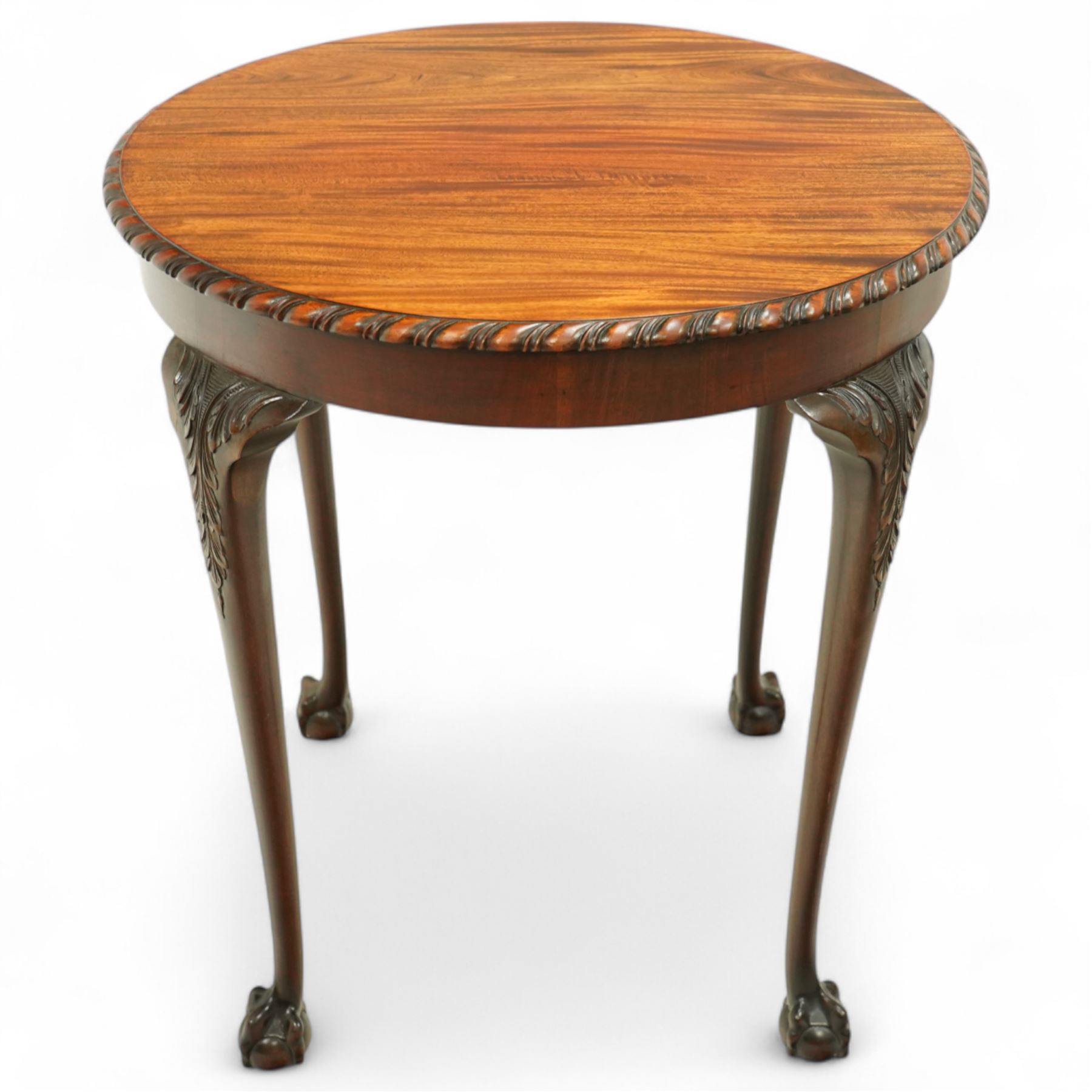 Early 20th century mahogany circular occasional table, moulded top with gadroon edge over carved cabriole legs with acanthus decoration to the knees, terminating in claw and ball feet