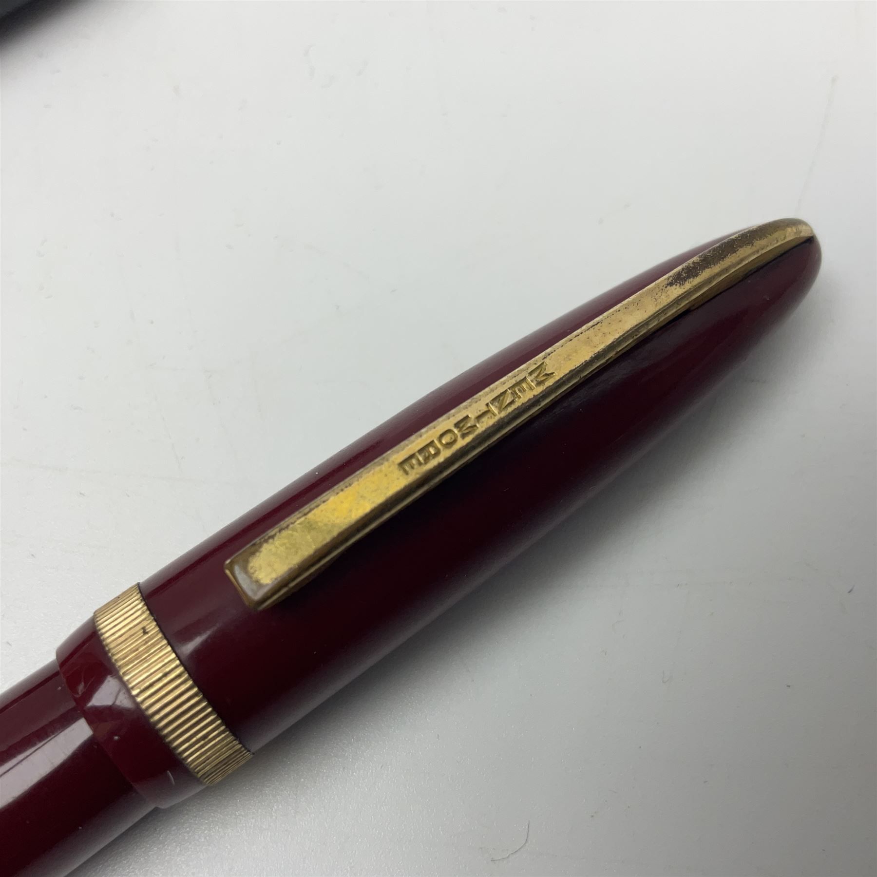 Four fountain pens, each with 14ct gold nibs, comprising Mentmore Paramount, Parker Junior Duofold, Conway Stewart marbleised pen and Waterman's, together with a 14ct gold Conway Stewart 5B nib