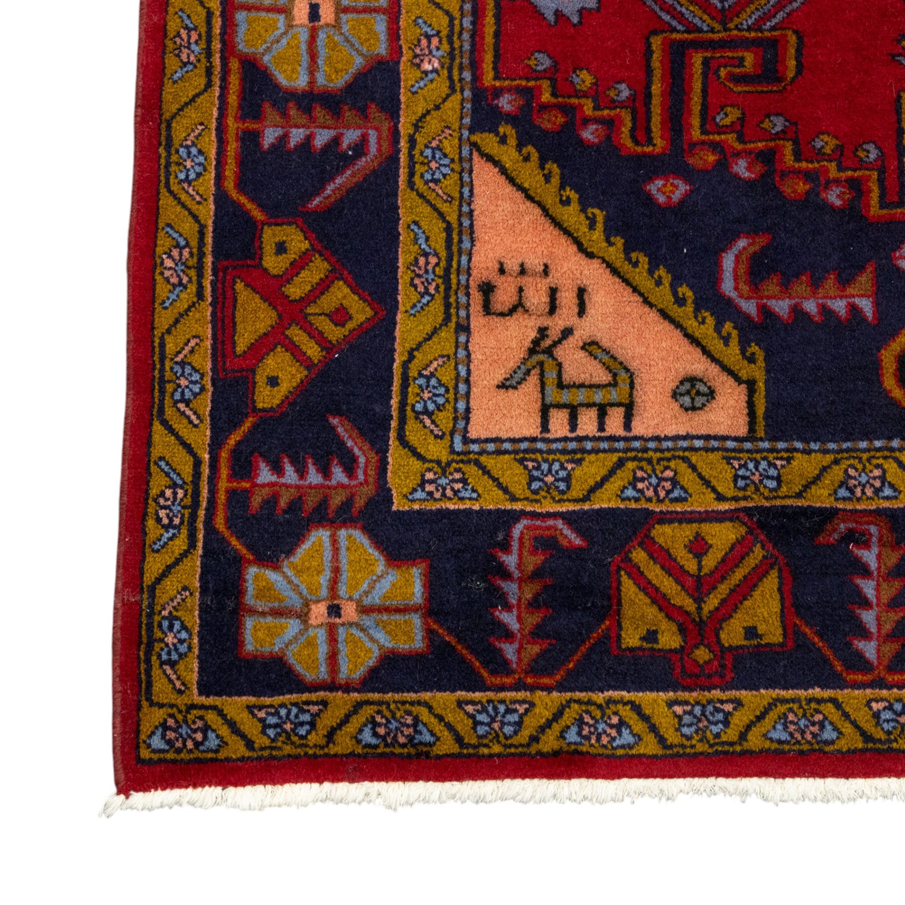 Turkish Anatolian hand-knotted carpet, red field centred by a large pale blue geometric medallion flanked by pink octagonal medallions, scattered stylised motifs, enclosed by multiple geometric borders