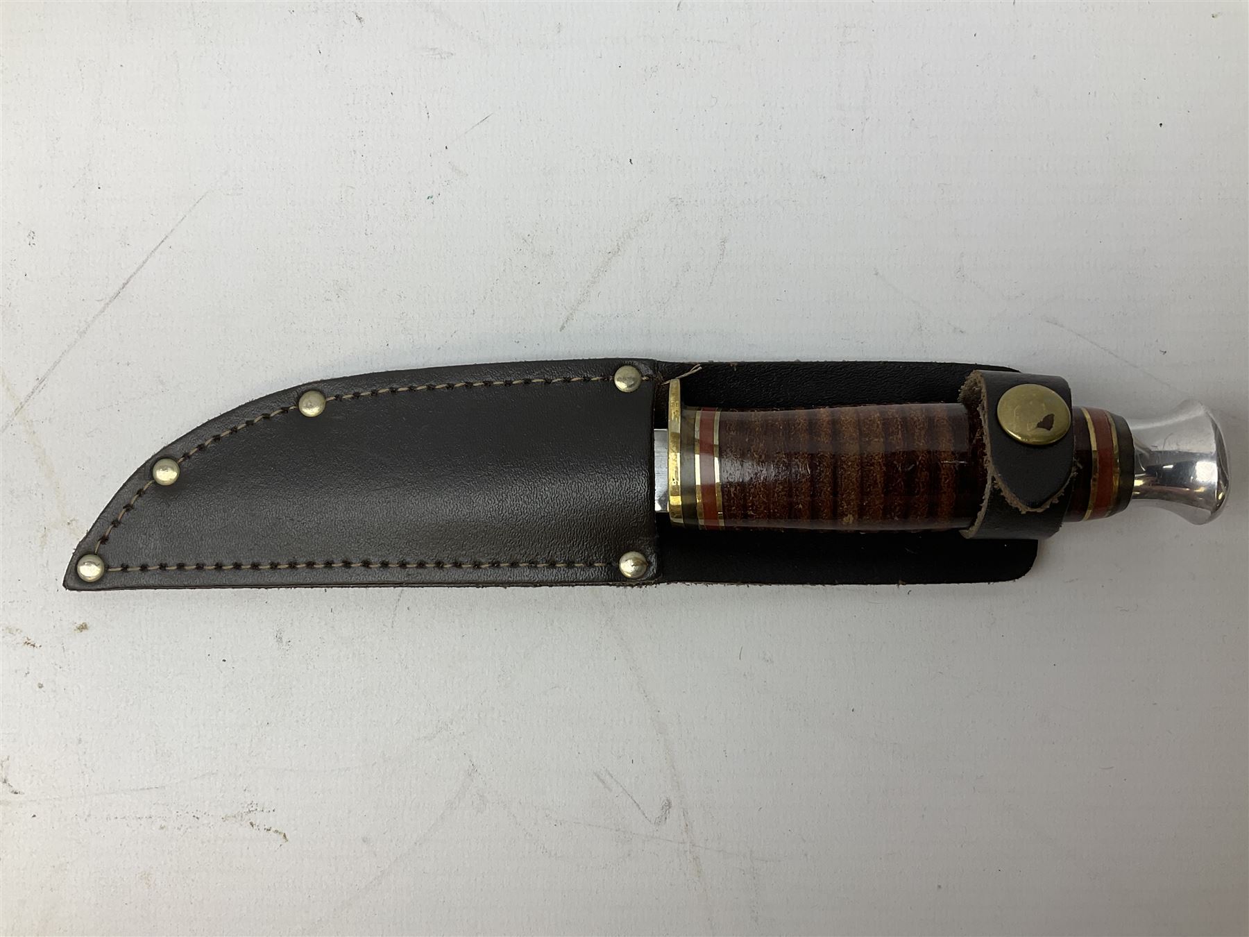 Three hunting knives, each blade marked A. Wright & Sons Sheffield, one with leather handle, one with horn handle and one with antler handle; each with leather sheath (3)