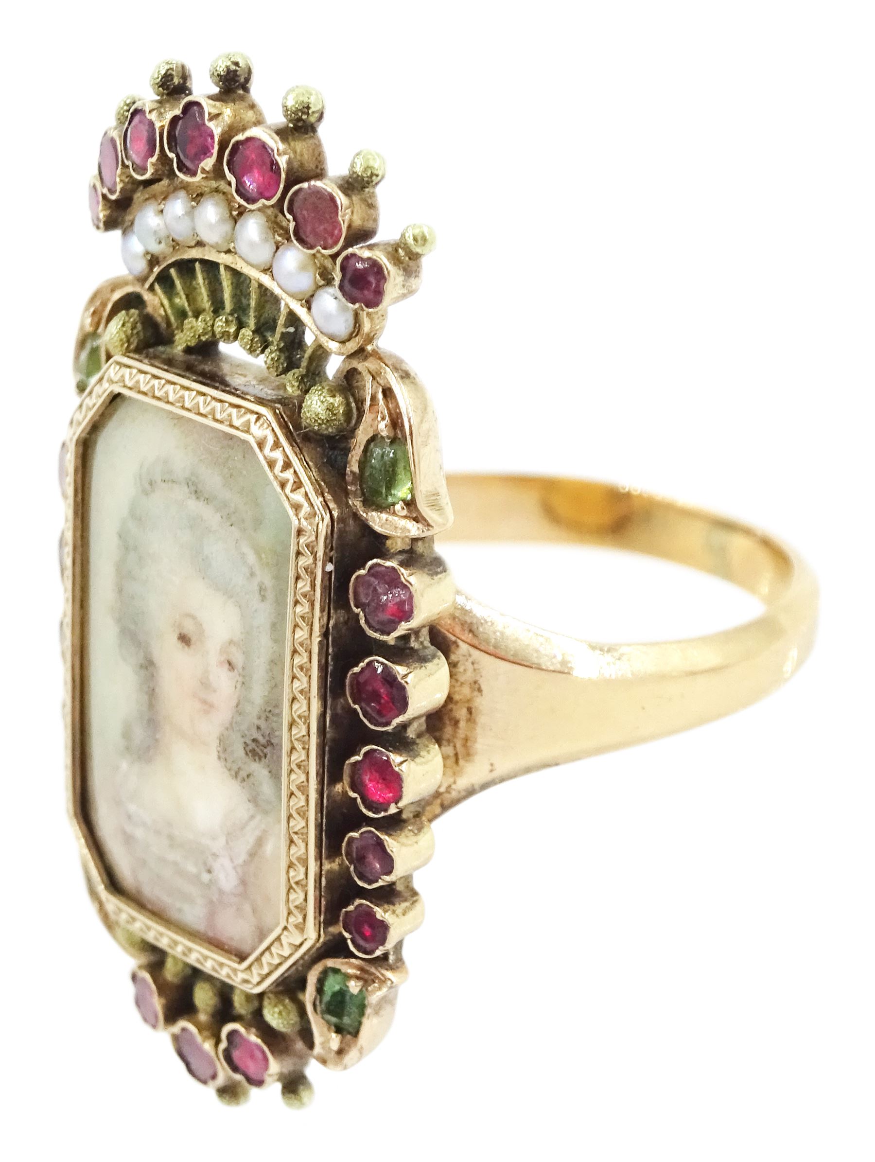 19th century 18ct gold portrait ring, set with an octagonal miniature of a woman wearing a pink dress on ivory, under a glazed panel, within a milled bezel and garnet surround, surmounted by a coronet set with seed pearls and further garnets. This lot has been registered for sale under Section 10 of the APHA Ivory Act