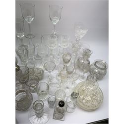 A number of Victorian tumblers and Edwardian drinking glasses, together with a large quantity of other later glassware, to include a glass table lamp base, drinking glasses of various forms, a number with cut decoration, other assorted cut glass including jug, vases, jars and covers, etc. 