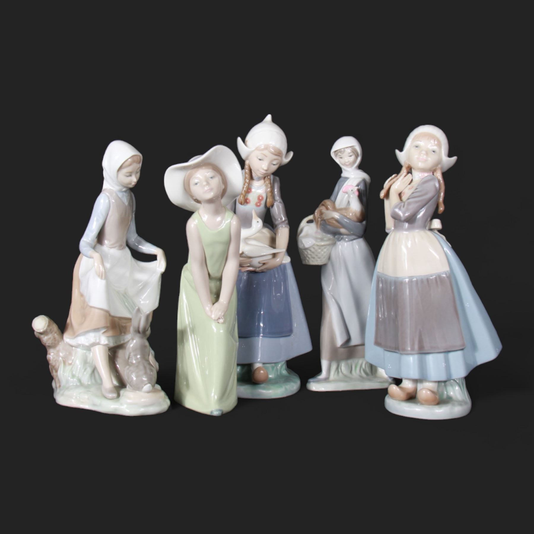 Five Lladro figures, including Dutch Girl with Duck no 5066, Girl With Cockerel no 4591, Rabbit Food no 4826 etc 
