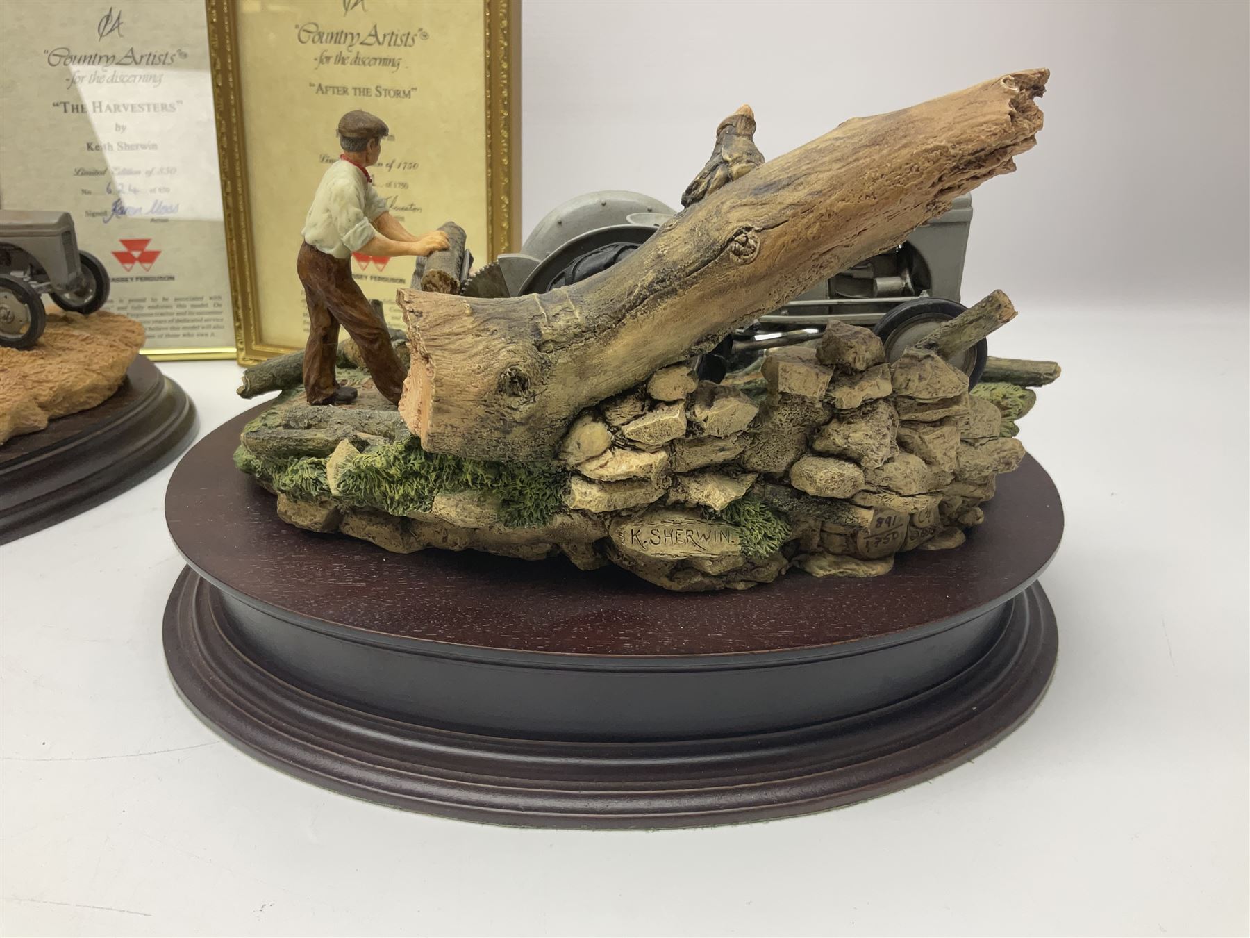 Two Country Artists figures, After the storm no CA831, limited edition 891/1750 and The Harvesters, limited edition 824/850, both with wooden base and certificates of authenticity