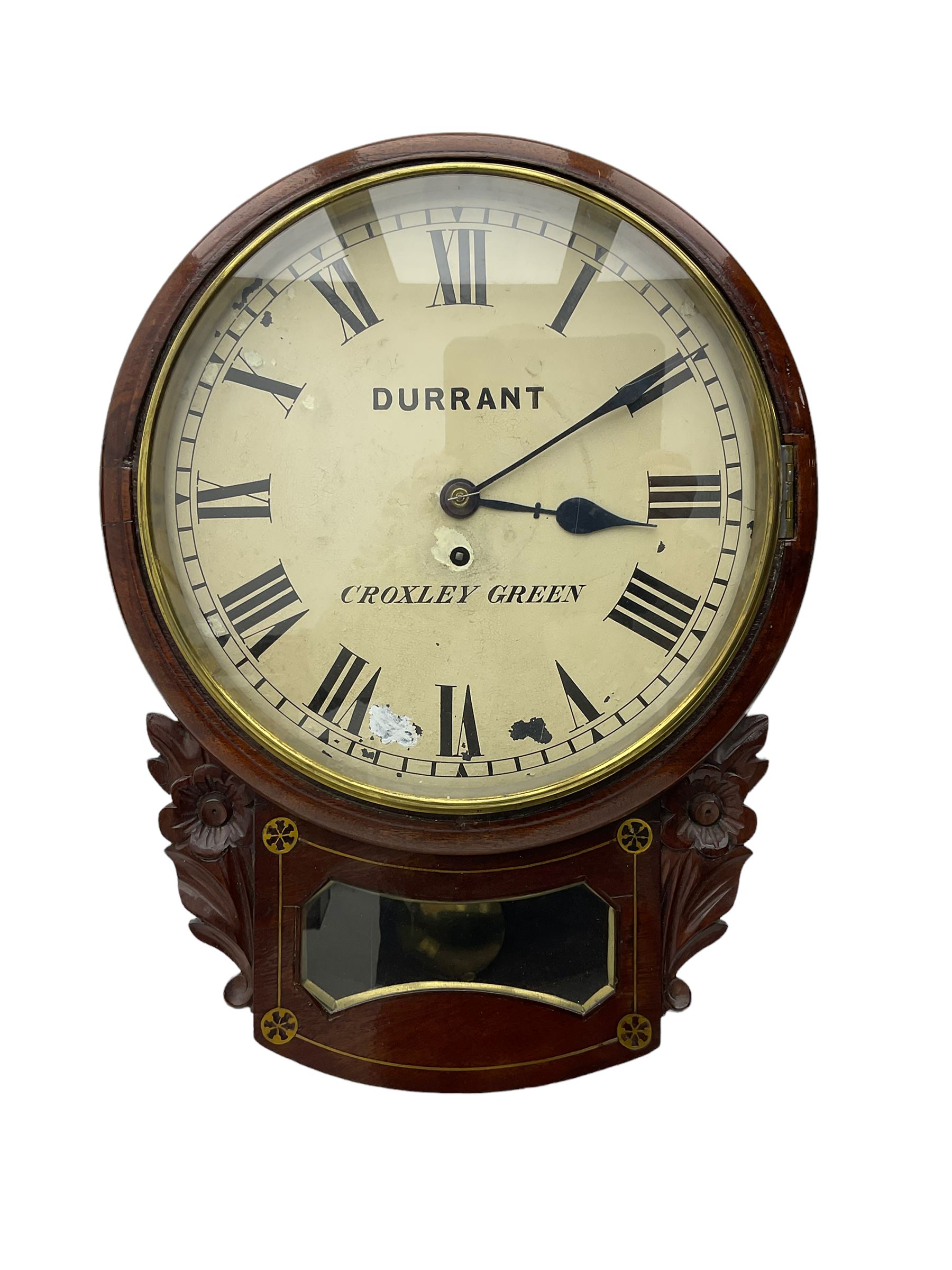 A late 19th century drop dial fusee wall clock in a mahogany case with brass inlay and a carved representation of flowers flanking the glazed pendulum viewing glass, with case side door and pendulum adjustment door, 12