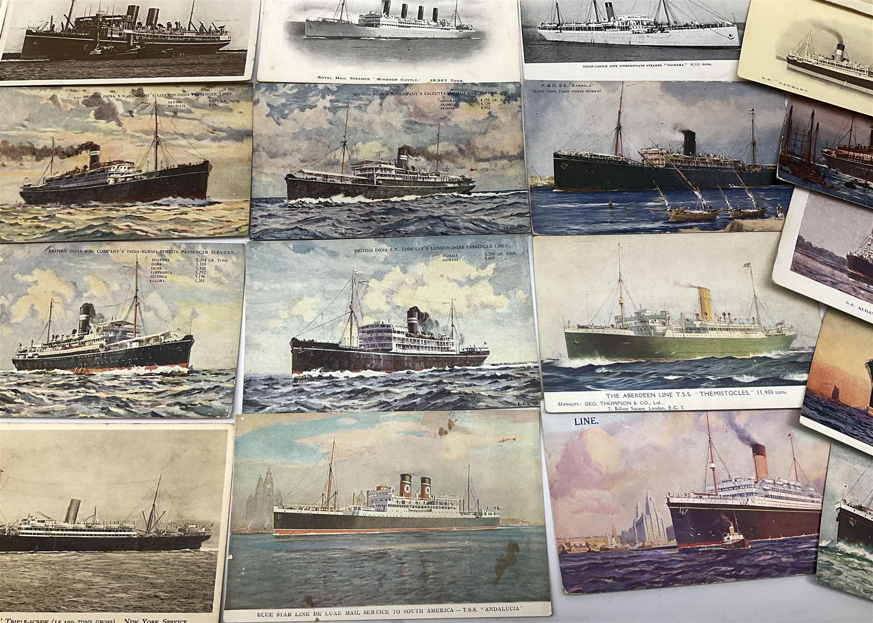 Sixty-five early 20th century postcards of passenger liners including White Star, Red Star, Atlantic Transport, Anchor, Cunard, Henderson, Booth, Union Castle, Holland America, Lamport & Holt, P. & O., New Zealand, Canadian Pacific, British India etc; and ten Edwardian postcards of Naval warships and officers (75)