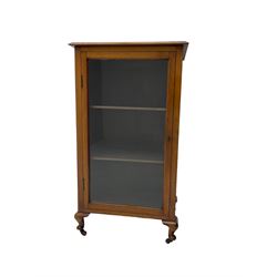 Small Edwardian walnut cabinet, fitted with single glazed door