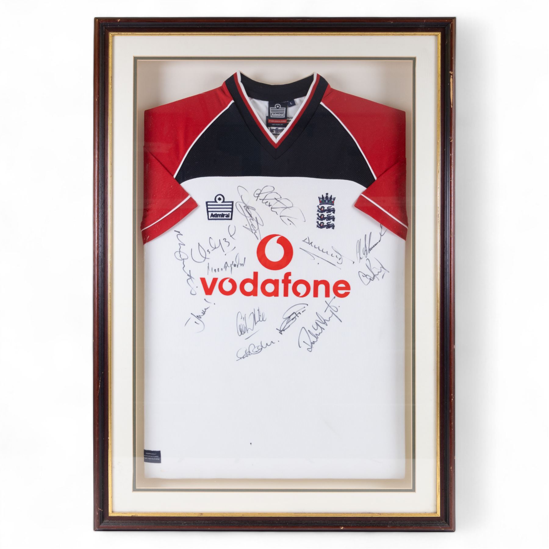 Signed 2002/2003 season England Cricket shirt, signed by thirteen England players including Marcus Trescothick, Darren Gough and Craig White, contained within a glazed wooden display case, frame H96cm