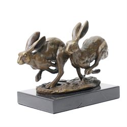 Bronze figure group, modelled as two hares in chase, after 'Nick', with foundry mark, upon...