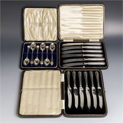 Set of six 1920s silver teaspoons with engraved initials, together with two sets of silver handled tea and fruit knives, all hallmarked and all within fitted cases