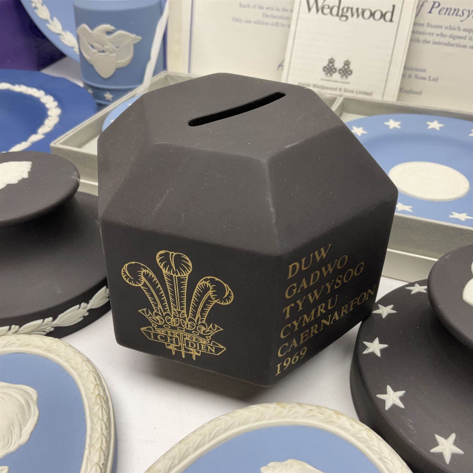 Collection of Wedgwood Jasperware, to include black Eisenhower Bust, two black basalt paperweights, one depicting an eagle and one depicting Julius Caesar, a blue Zodiac plate, Man on the Moon commemorative plate, American Independence Bicentennial plate and Royal commemorative ware, etc, all with impressed marks beneath, some with boxes