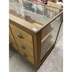 20th century oak and glazed haberdashery shop's display cabinet, fitted with twelve slides, on skirted base - THIS LOT IS TO BE COLLECTED BY APPOINTMENT FROM THE OLD BUFFER DEPOT, MELBOURNE PLACE, SOWERBY, THIRSK, YO7 1QY