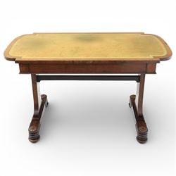 William IV mahogany library table, rectangular top with rounded edges inset with gilt and blind tooled leather writing surface, fitted with opposing frieze drawers, raised upon shaped trestle end supports united by a central upper stretcher, terminating in stylised bun feet with applied roundel bosses