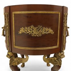 An imposing and richly adorned Empire Revival jardiniere of circular form, decorated with finely cast gilt bronze laurel garlands and floral swags, interior with a modern brass liner, sides with gilt bronze carrying handles, raised on three tripod legs with classical caryatid masks with wings terminating in lion paw feet, circa 1900

Provenance: This jardiniere formed part of the original furnishings of the opulent Empire Room at Kinloch Castle, built by industrialist George Bullough in 1900.

An original inventory number, ‘X954’, is inscribed on one facing, verifying its presence in the Kinloch Castle collection. This jardiniere epitomises the lavish taste of the Edwardian elite and the high standards of craftsmanship employed in the furnishing of Kinloch Castle, the first private home in Scotland to be lit by electricity and famed for its extravagant interiors.


