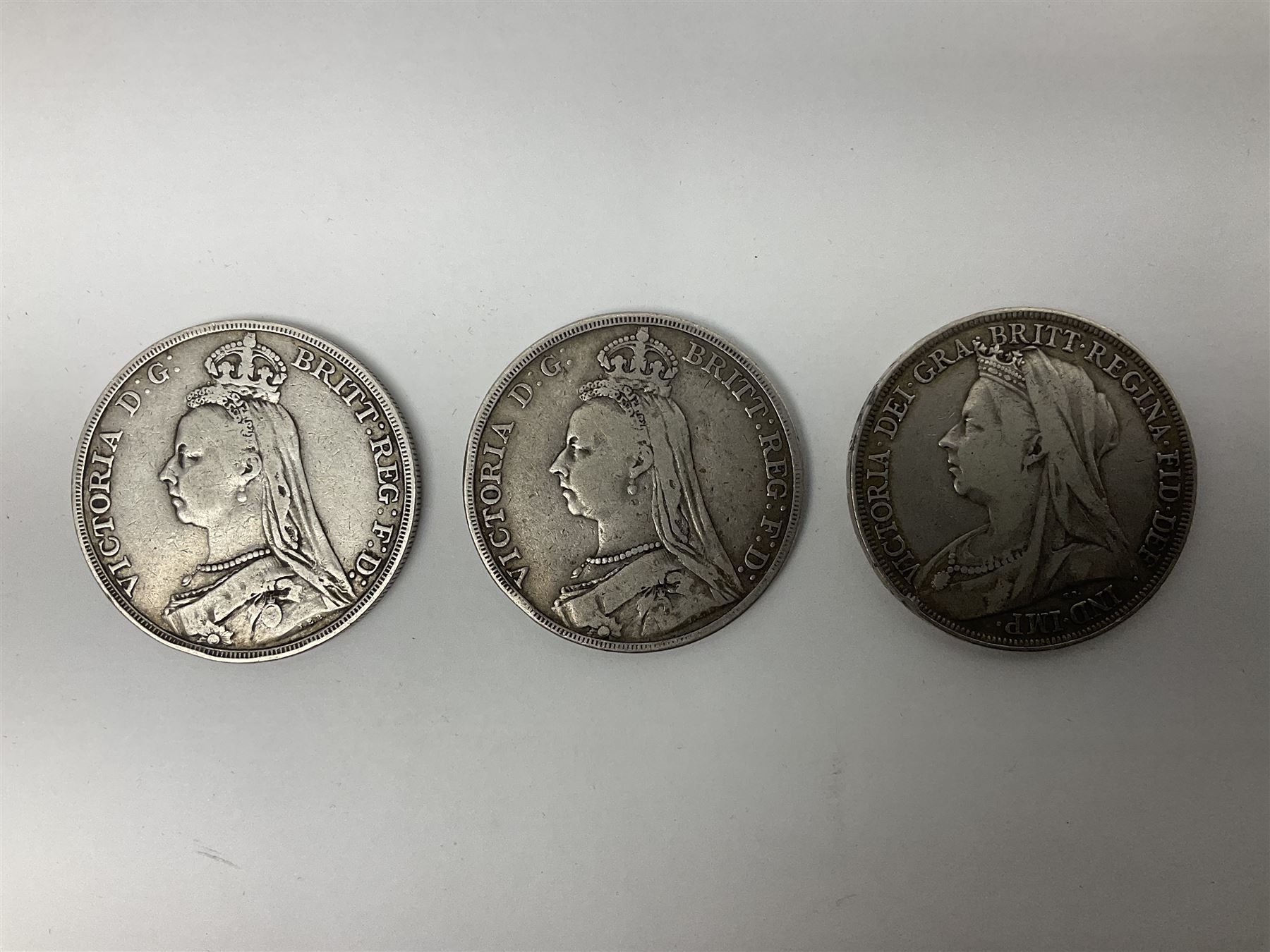 Three Queen Victoria silver crown coins dated 1889, 1892 and 1894