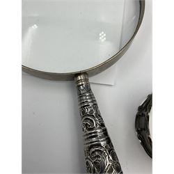 Group of silver, comprising of silver handled magnifying glass, silver mounted oval photograph frame, engraved 'Presented by Serco', pair of sugar tongs, silver handled shoe horn and a napkin ring, all hallmarked, approximate weighable silver 1.38 ozt (43 grams)