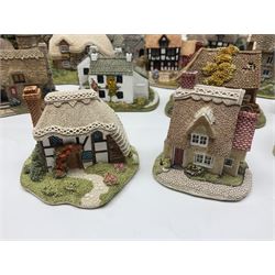 Seventeen Lilliput Lane models, to include The Dalesman, Windy Ridge, Cat Coombe Cottage, Granny Smiths, ect, all with deeds and original boxes (17)