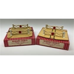 Hornby Dublo - 5080 Signal Cabin with pack of Station Names; two D1 Footbridges, one with instructions; and two 2460 Plastic Level Crossings suitable for two-rail system; 2400 T.P.O. Mail Van Set for two-rail system all boxed; together with three plastic brick effect tunnel mouths for double track layout (9)