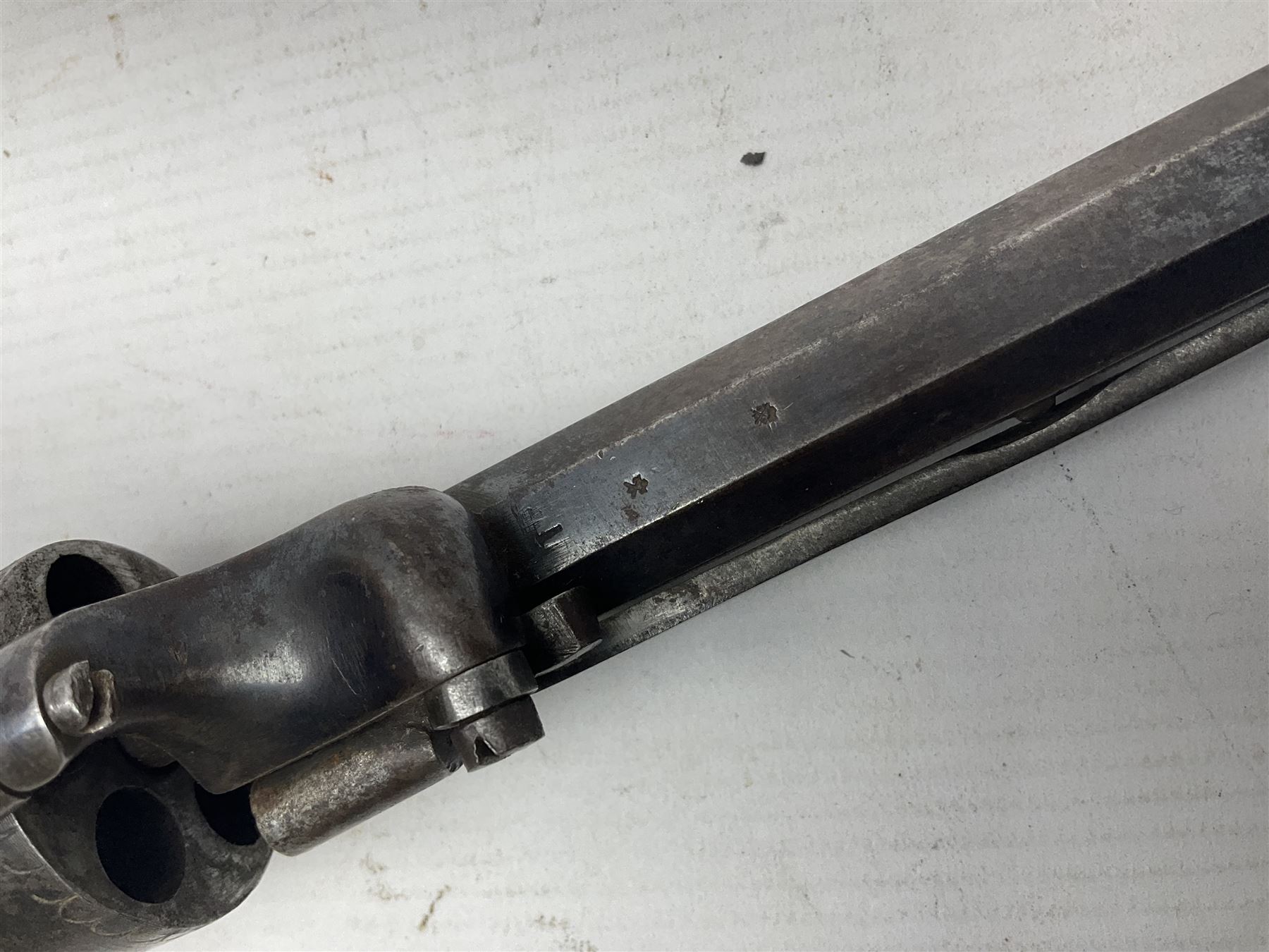 Mid-19th century Smith London .36 cal. transitional five-shot percussion revolver, the 12cm rifled octagonal barrel with side loading lever, side safety, some engraved decoration and chequered two-piece grip L28cm overall