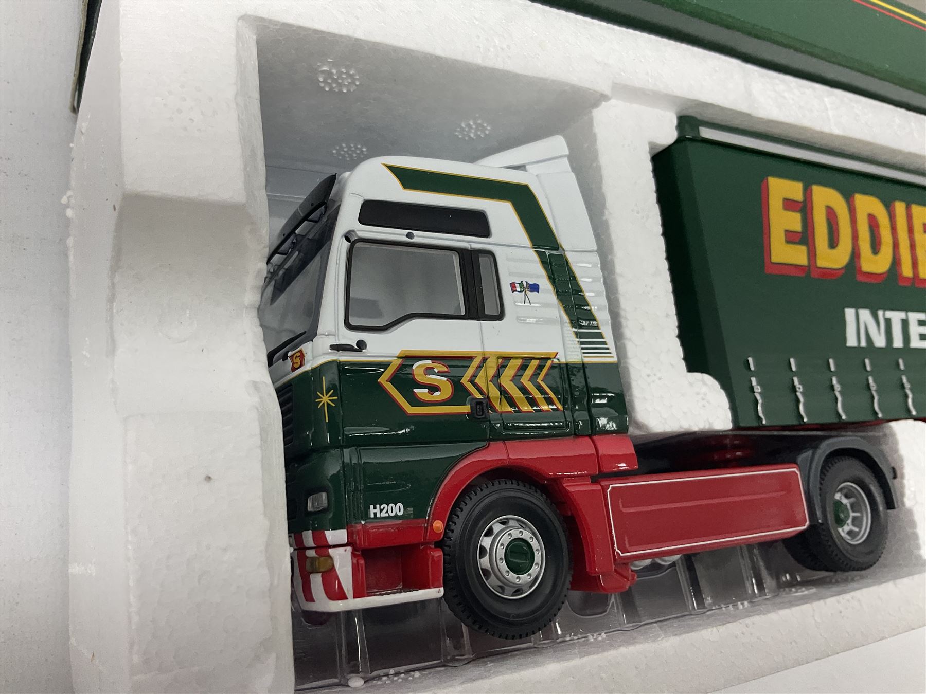 Corgi Eddie Stobart - three lorries; limited edition CC12802 Scania T-Cab Bulk Tipper; limited edition CC13201 DAF XF Super Space Cab Curtainside; and CC13401 MAN TGA Curtainside; all boxed (3)