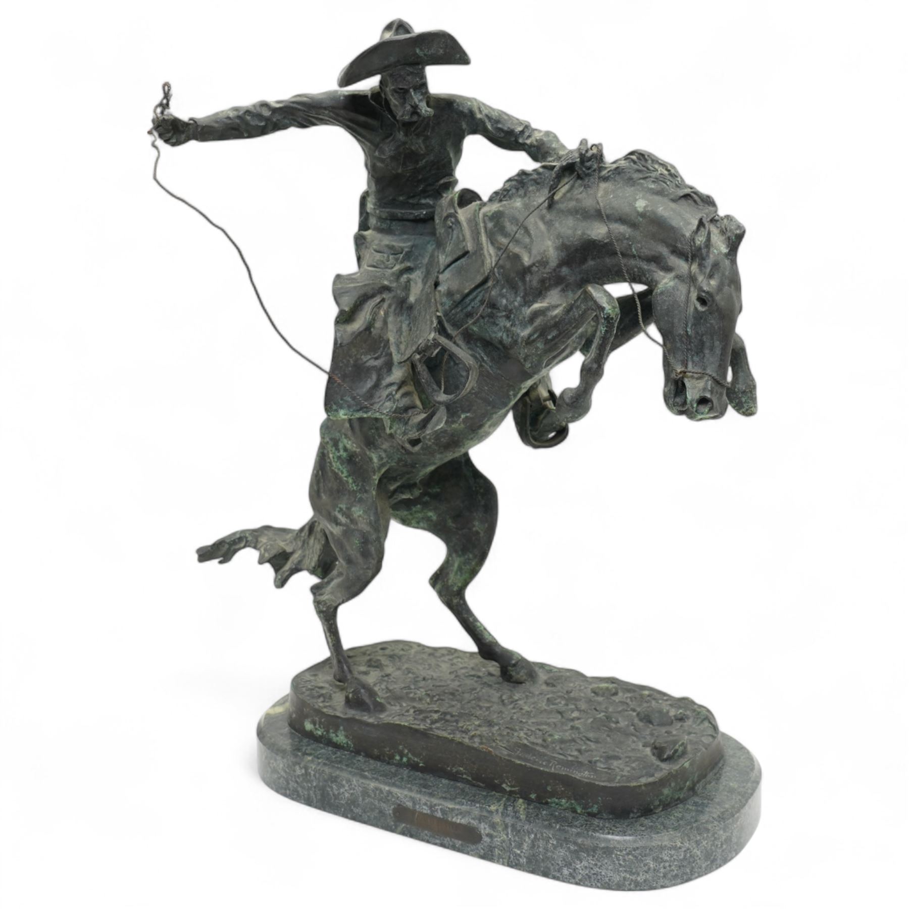 After Frederick Remington (American 1861-1909): 'Bronco Buster', limited edition bronze bearing signature and numbered 7/100, with foundry or ranch mark to horses backside of a triangle within circle, on green marble base, H56cm