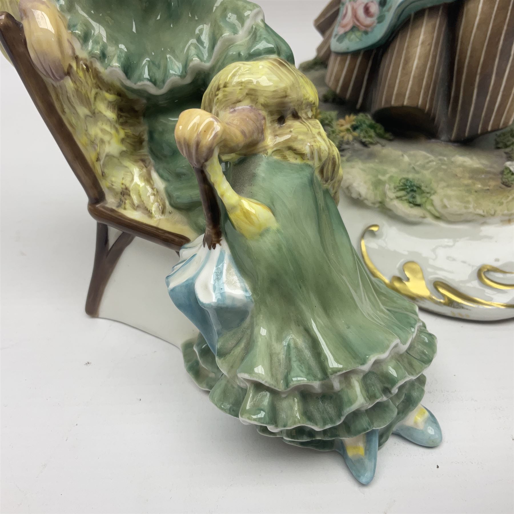 Two Royal Doulton figures, Buttercup HN2309 and Ascot HN2356, together with Capodimonte figure Hussar and His Lady 