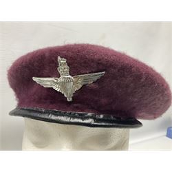 Four paratrooper berets - Russian, Italian, British and Foreign Legion; all with badges (4)