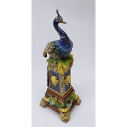  Wilhelm Schiller & Sons majolica vase modelled as a Peacock perched on pedestal, moulded satyr mask heads on mask feet, stamped, H35cm   