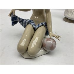 Three Lladro figures, comprising Modern Mother no 5873, Dropping the Flowers no 1285 and On the Beach no 1481, all with original boxes, largest example H30cm