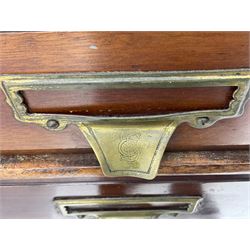 The Shannon Limited - late Victorian walnut filing cabinet, fitted with twenty-four small filing drawers, each with brass handle with label holder, fluted uprights, double cupboard below enclosed by two panelled doors, on turned feet, with brass plaque inscribed 'The Shannon, Limited, Ropemaker St. London, E.C.'