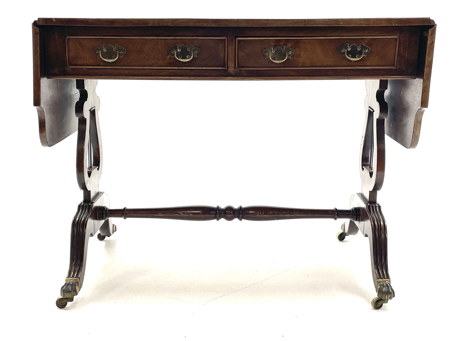 20th century walnut drop leaf sofa table, shaped drop leaf top over two drawers, on lyre shaped end pillars with splayed reeded supports joined by turned stretcher