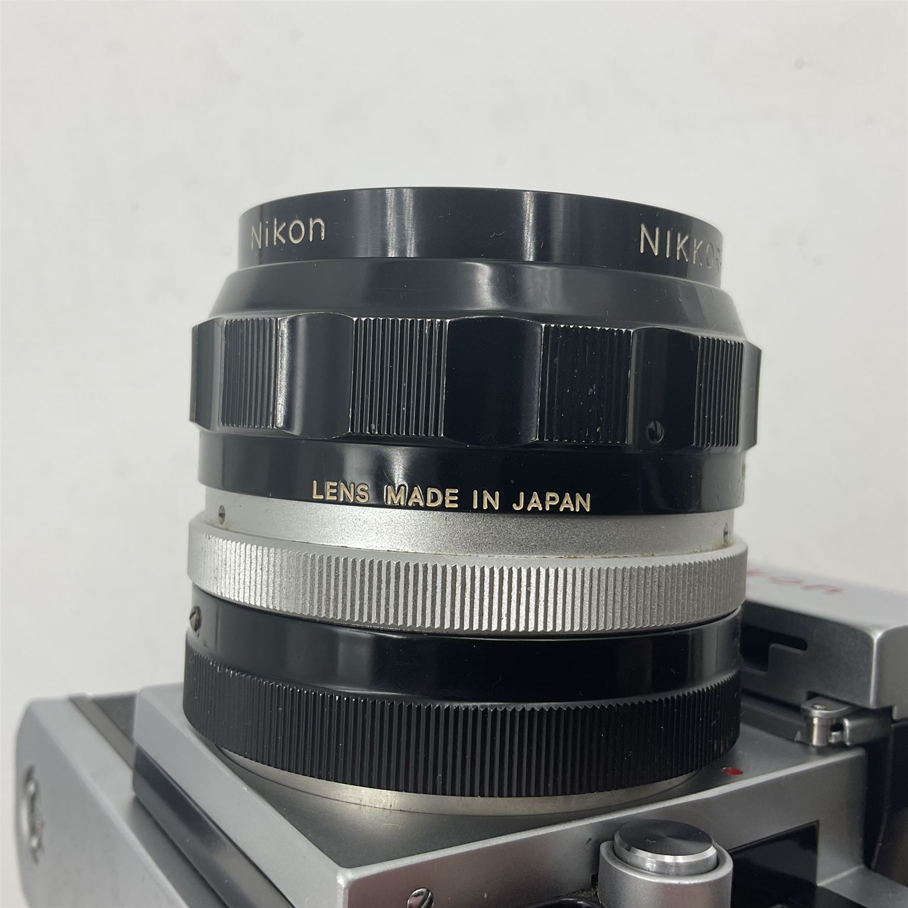 Nikon photomic Ftn camera body, with red engraving, serial no 7006572, circa 1969, with 'Nikon NIKKOR-O Auto 1:2 f=35mm' lens, serial no. 830478