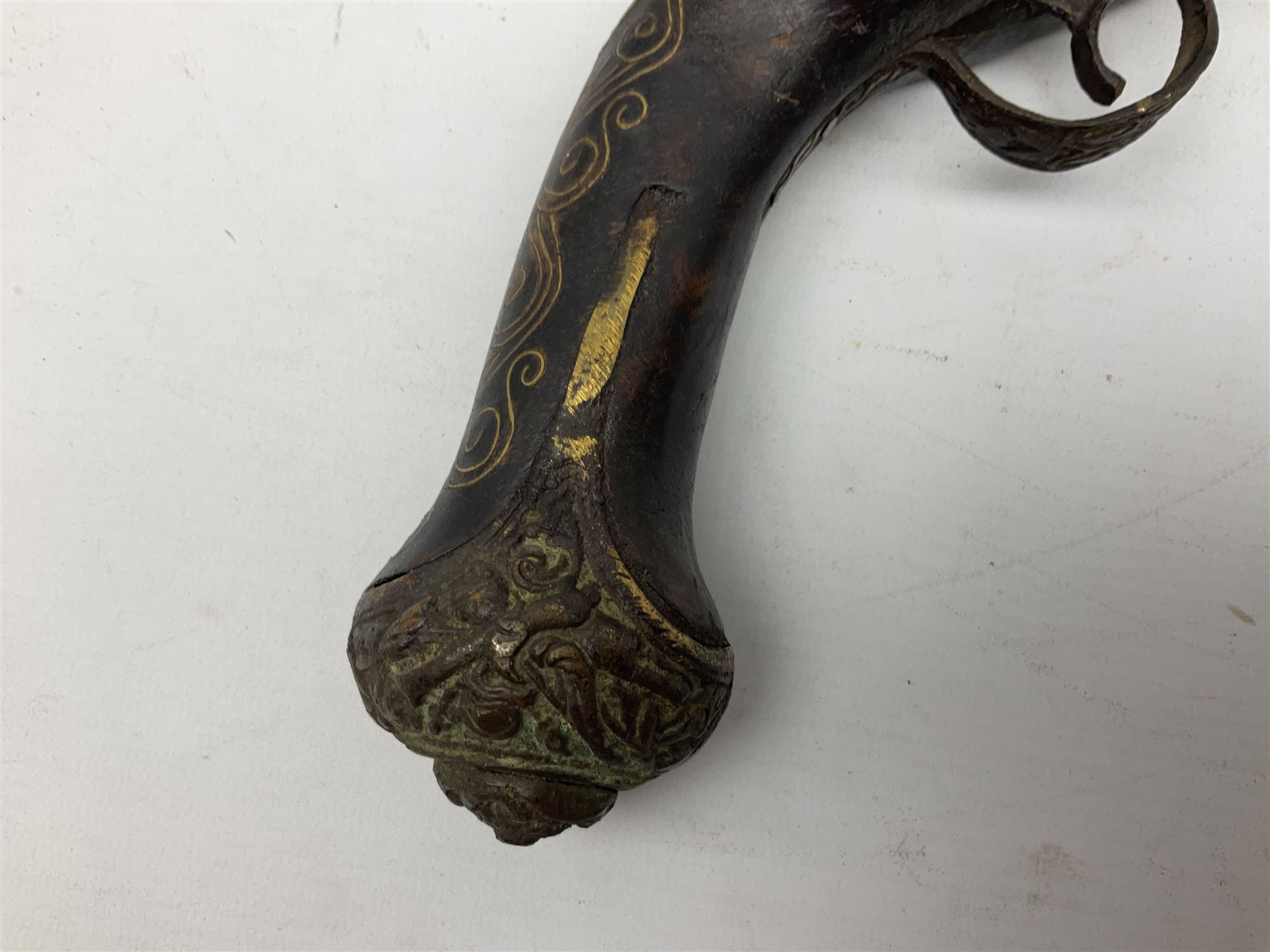 Reproduction flintlock pistol, the full walnut stock with brass filigree inlay and mounts and skull crusher butt L46cm; no visible proof marks FIREARMS CERTIFICATE REQUIRED OR RFD