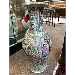 Large pair of 19th century Cantonese famille rose vases, each painted with various courtly scenes, including a display of warriors fighting on horseback before an official and his attendants, double Buddhist lion handles and applied at the shoulders with chilong, the lower band painted with Greek key motif, H58cm (2)