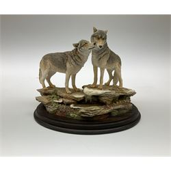 Three Franklin Mint figures, first example On The Prowl, on wooden stand H32cm, L63.5cm, Grizzly, H23cm and American Majesty by Ronald Van Ruyckevelt H37cm, together with five other figures.  