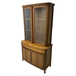 Nathan - teak wall display unit, raised display cabinet enclosed by two glazed doors, the lower section fitted with two drawers and double panelled cupboard 