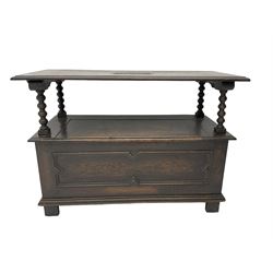 Mid-20th century oak monks bench or settle,  hinged metaphoric table back carved with foliate lozenge decoration, bobbin turned supports over hinged box seat compartment with panelled front