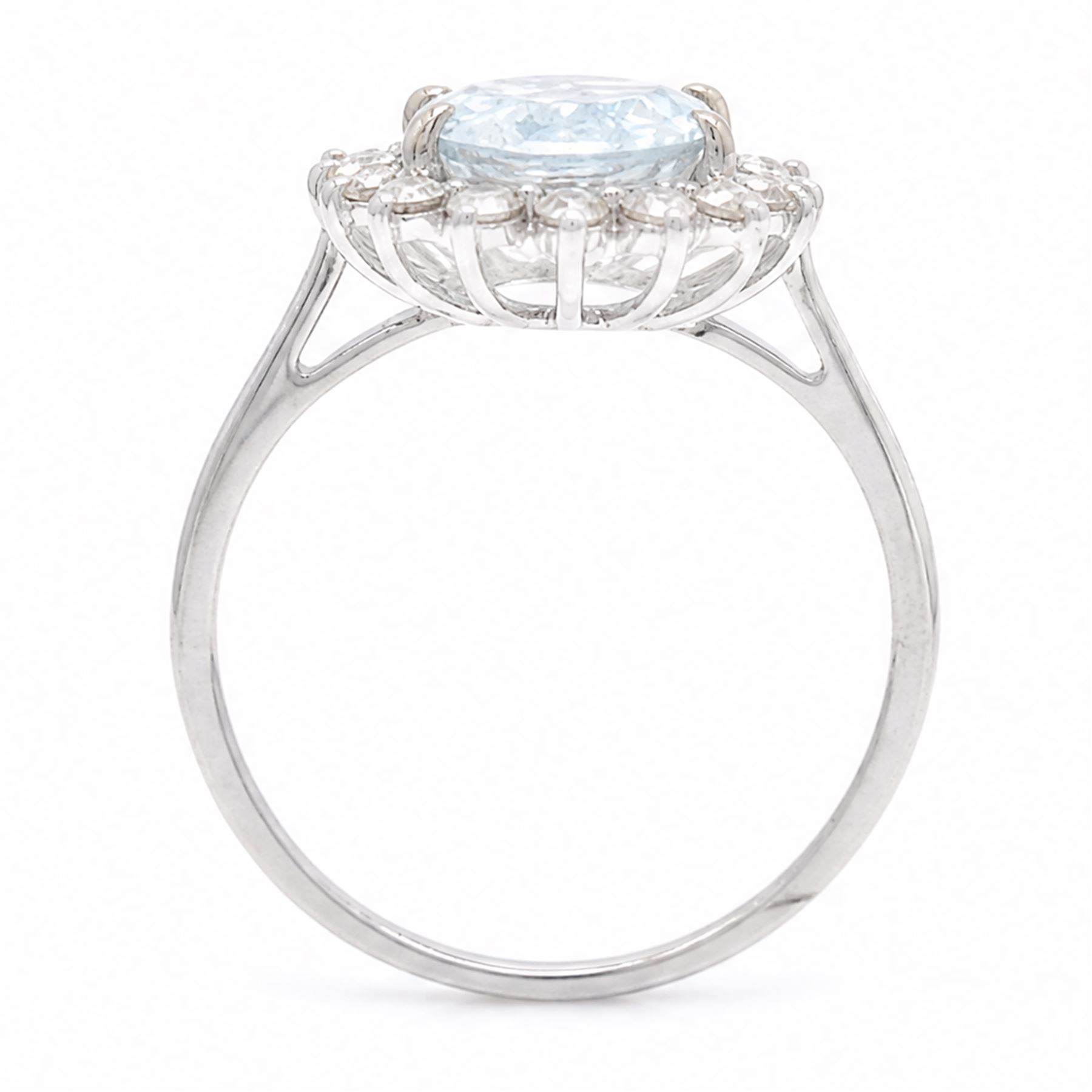 18ct white gold aquamarine and diamond cluster ring, single oval cut aquamarine of approx 2.05 carat, surrounded by sixteen round brilliant cut diamonds, stamped 18K, total diamond weight approx 0.50 carat