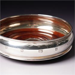 Pair of silver bottle coasters with turned wooden bases D12cm Sheffield 1998 Maker Carr's of Sheffield 