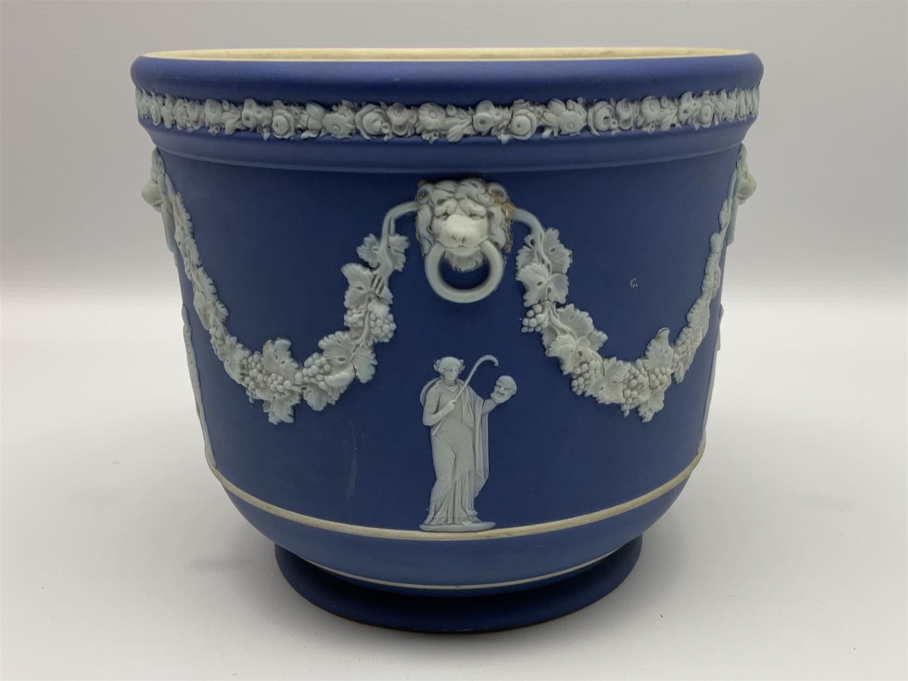 Victorian Wedgwood blue jasperware jardiniere H16.5cm; Victorian copper lustre jug; James Kent art deco style green glazed jug; and Beswick figure of a singing cat (4)