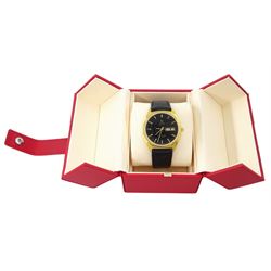 Omega Seamaster gentleman's gold-plated and stainless steel quartz wristwatch, Ref. 196.0126, Cal. 1345, black dial with baton hour markers and day - date aperture, on Omega black leather strap with buckle, boxed with Omega repair receipt dated 2023