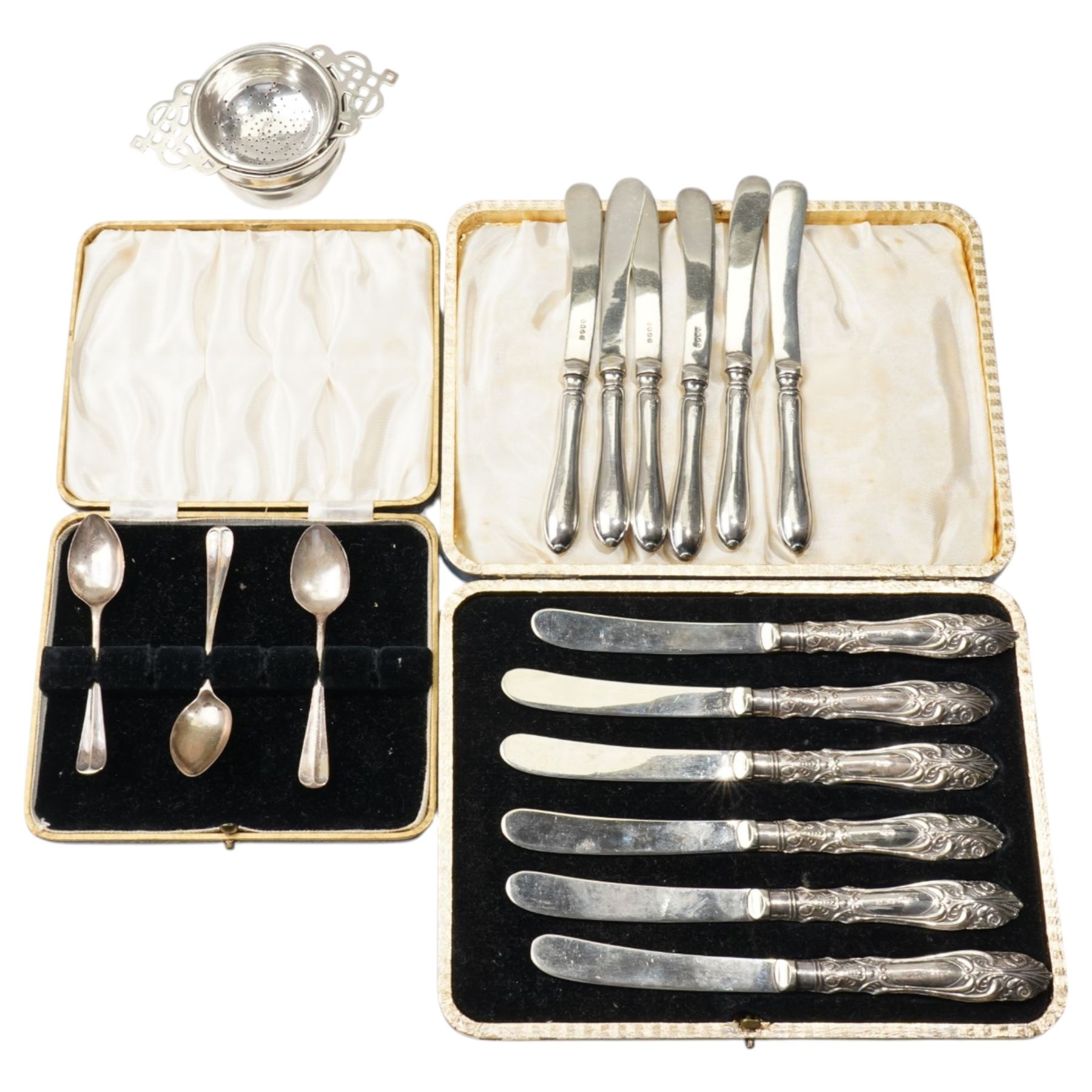 Silver tea strainer and stand Sheffield 1934, two sets of six silver handled pastry knives and three silver teaspoons